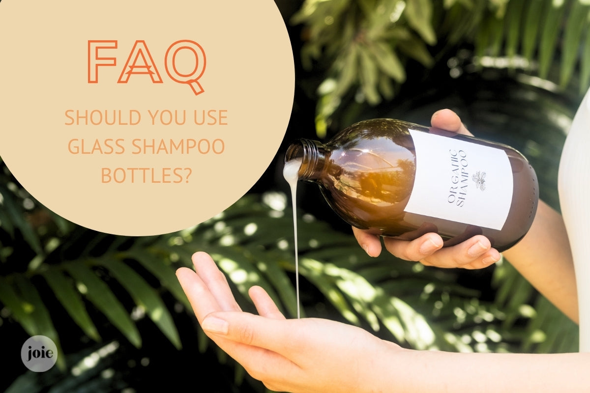 Woman pouring shampoo from a glass bottle into her hand