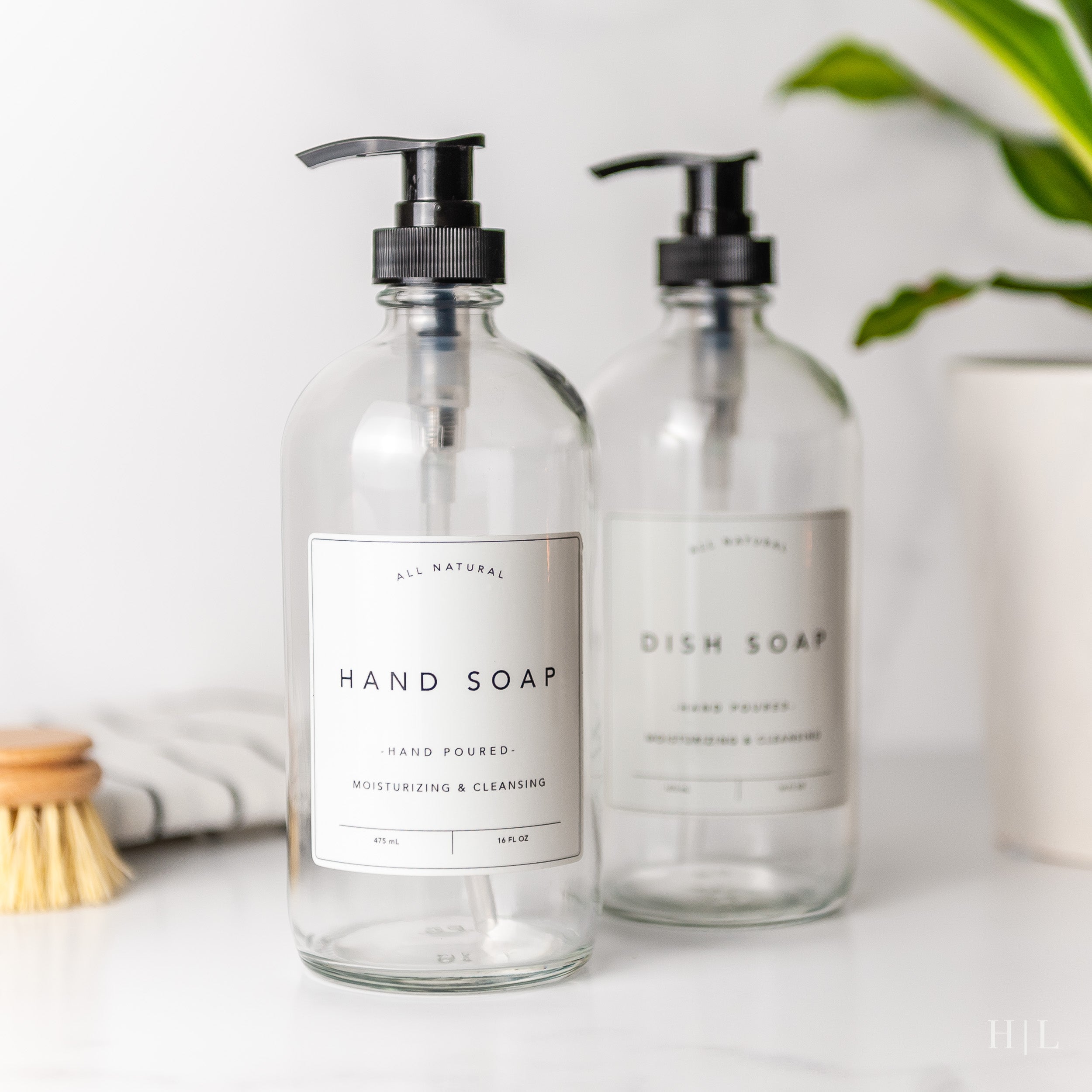a couple of bottles of soap sitting on top of a counter