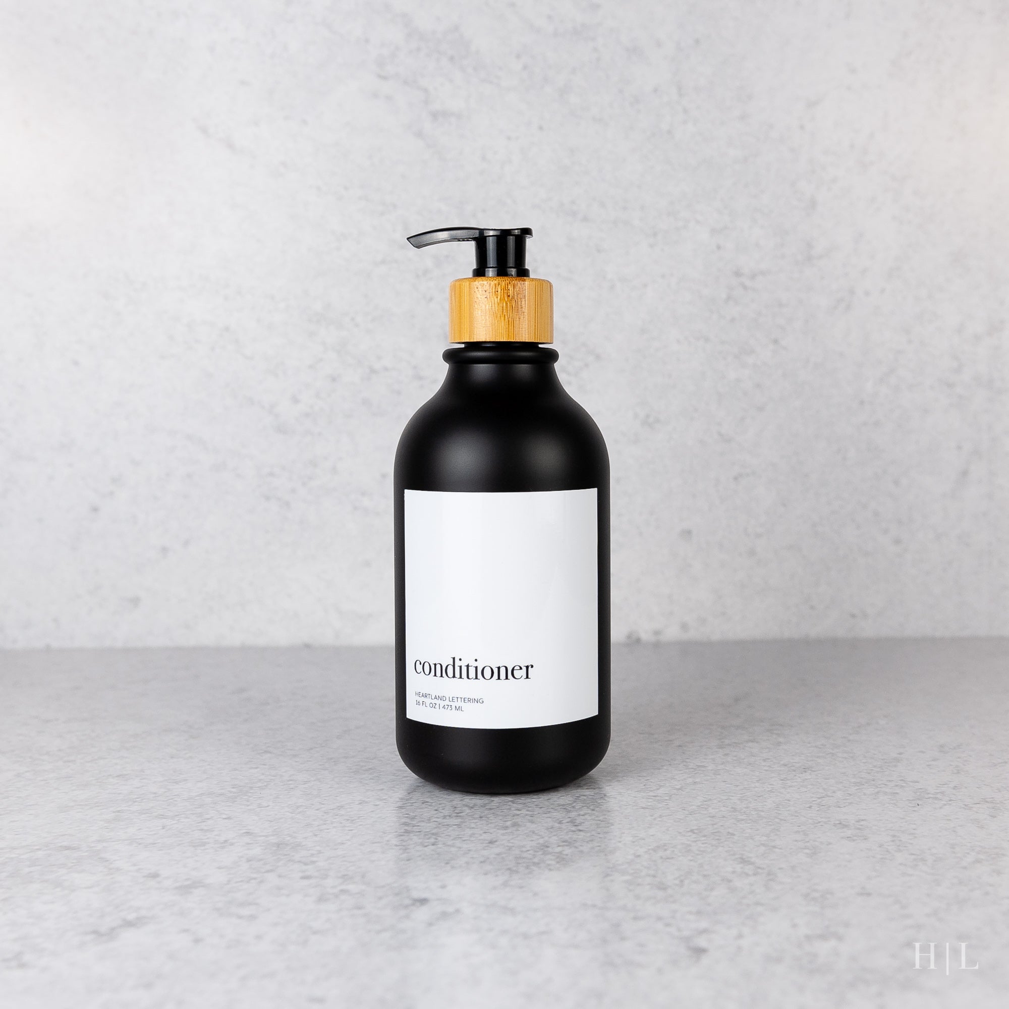 a bottle of liquid sitting on a counter