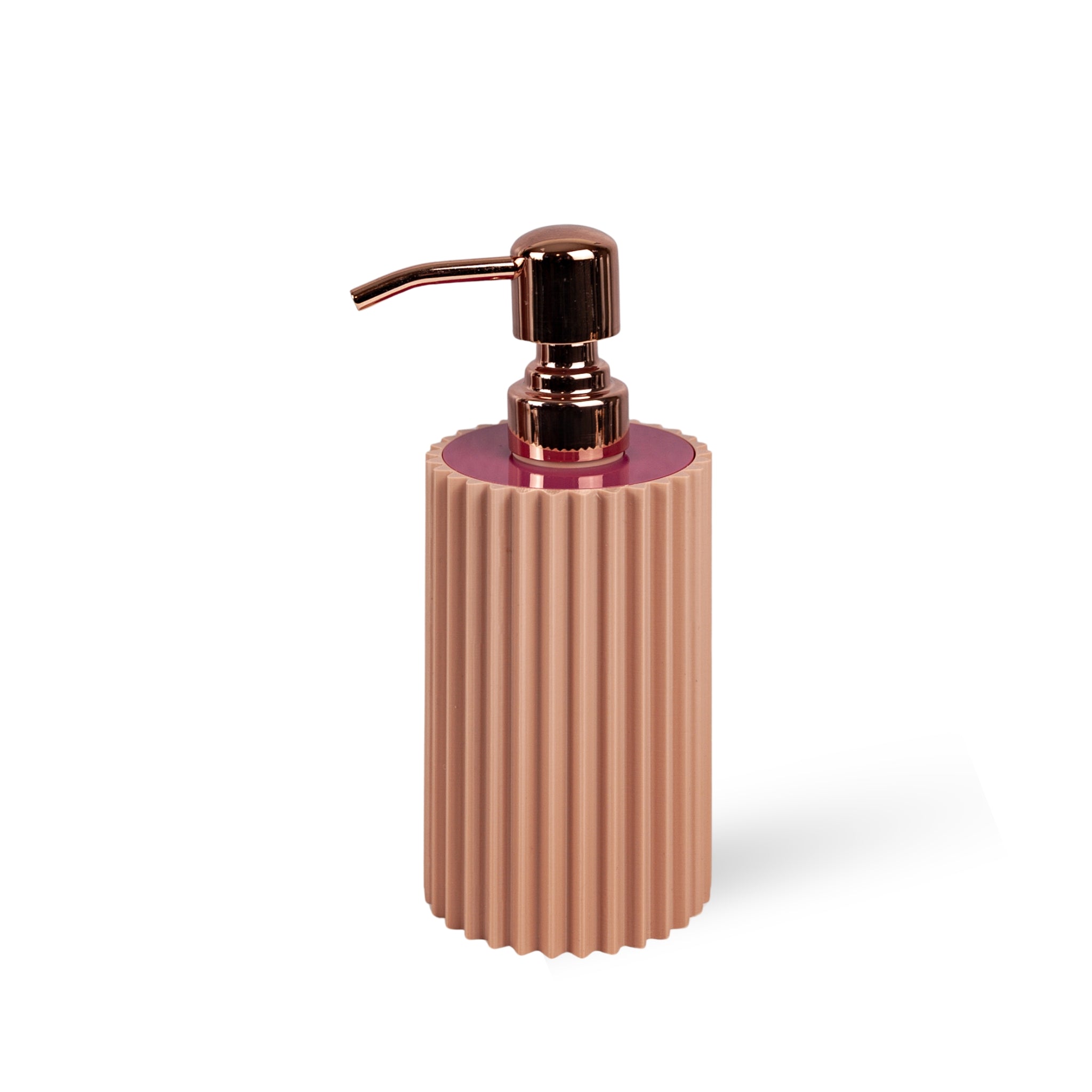 Rose gold soap dispenser with ribbed design on a white background