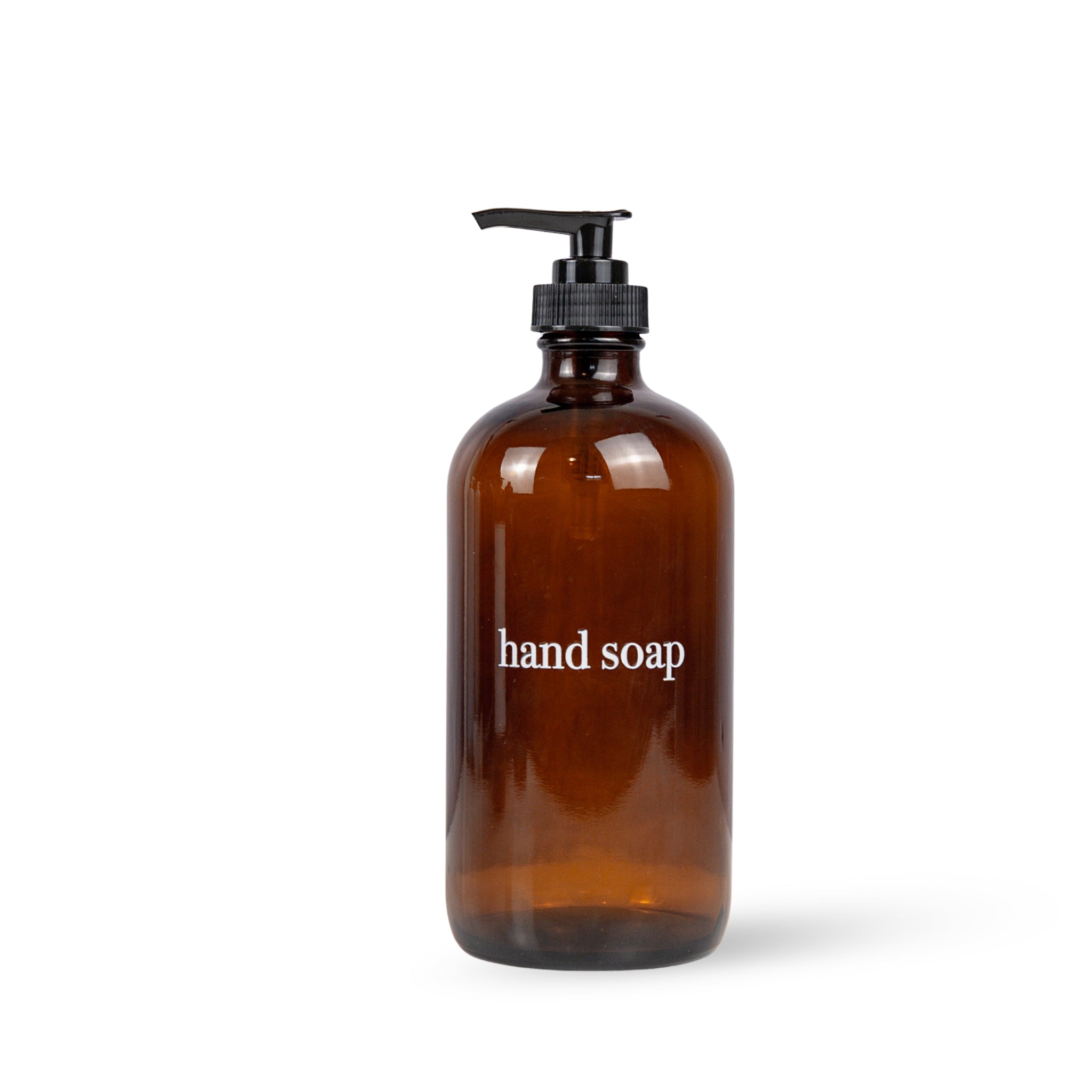 Brown glass hand soap bottle with pump on a white background