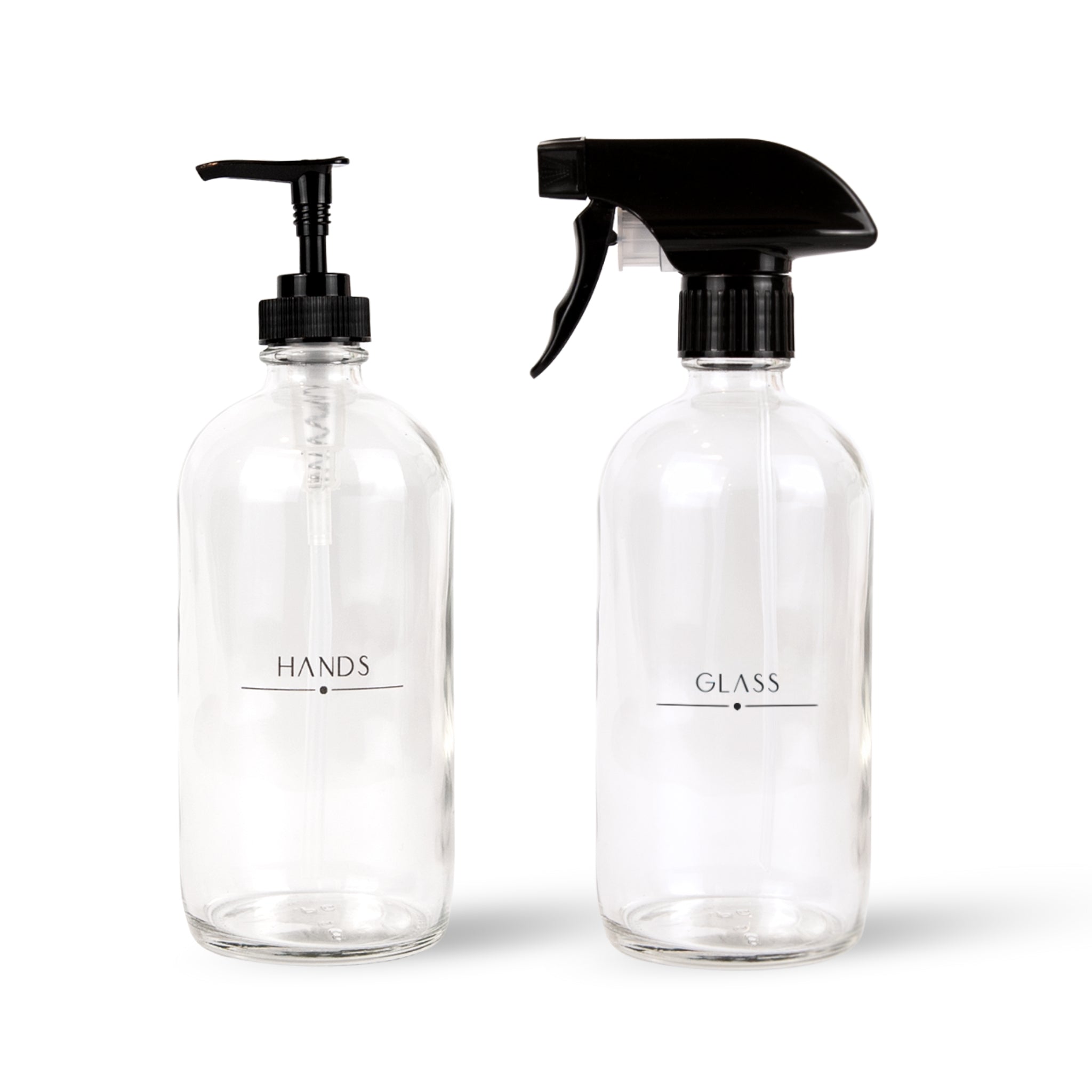 Two clear bottles with black pumps and sprayers on a white background