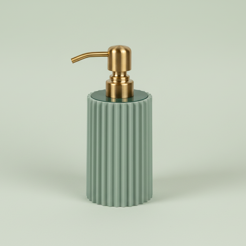 Sage green ribbed soap dispenser with gold pump on a light beige background