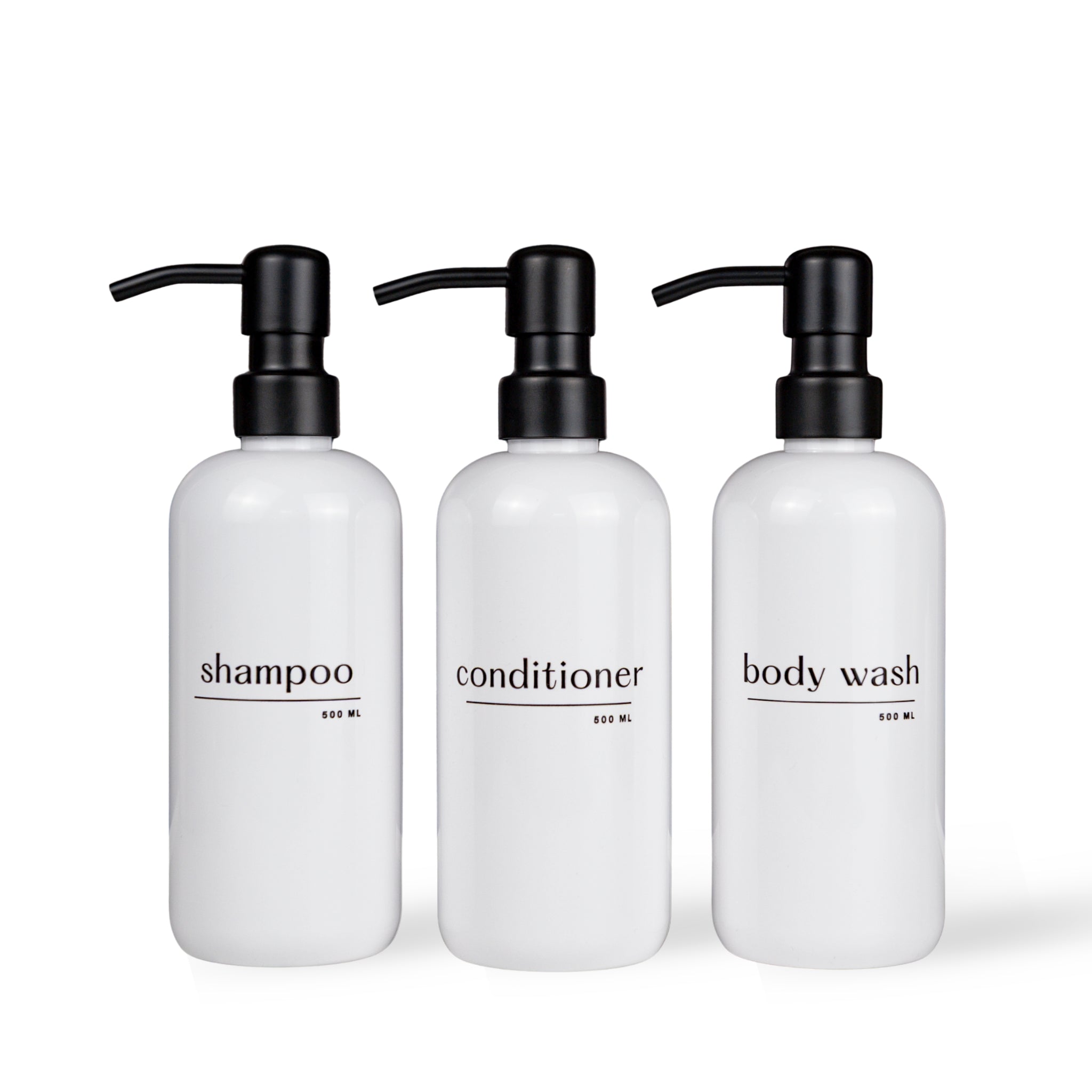 Three white bottles labeled 'shampoo', 'conditioner', and 'body wash' with black pumps on a white background.