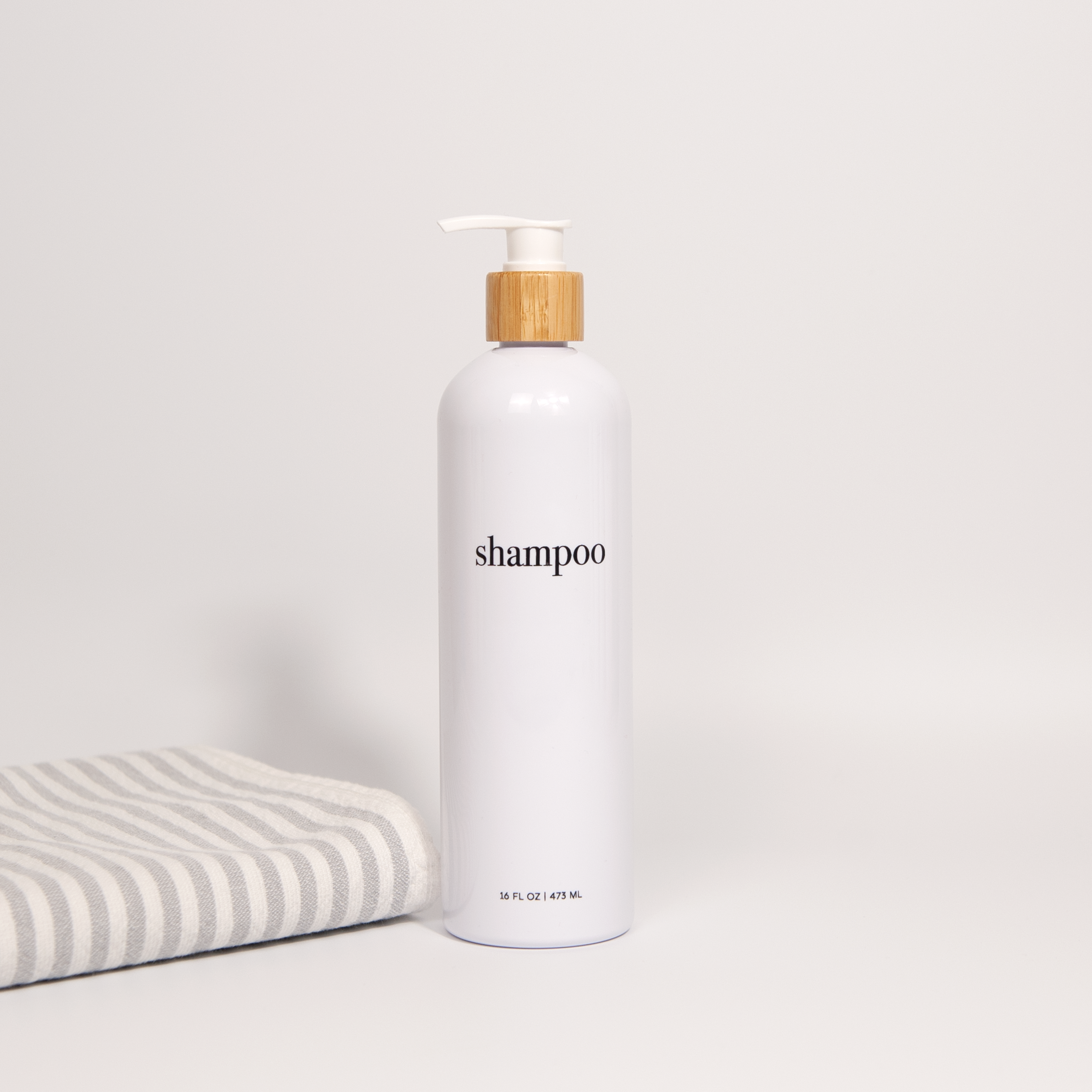 Hamptons Collection White Minimalist Slim Printed Shower and Soap Dispenser Bottles