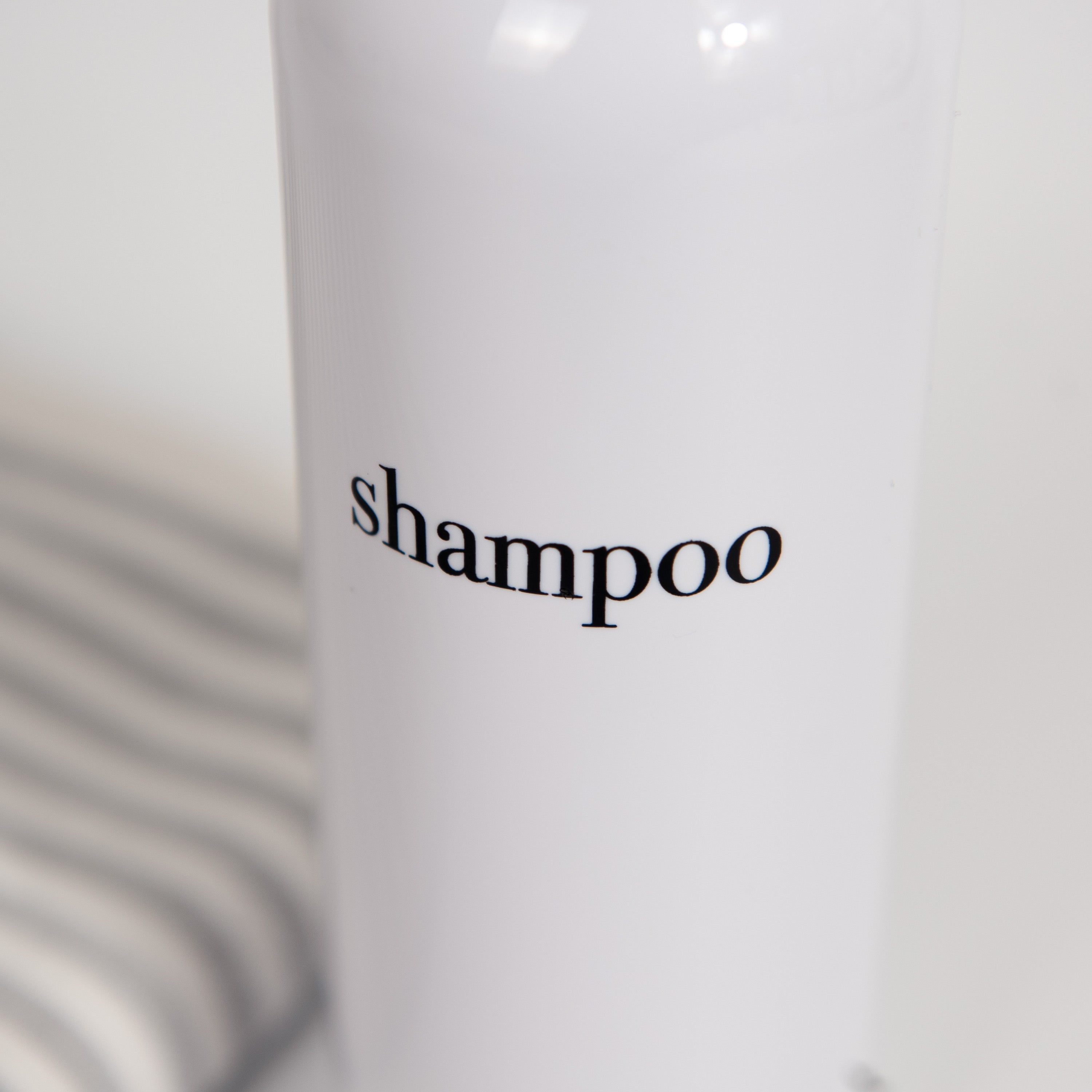 Hamptons Collection White Minimalist Slim Printed Shower and Soap Dispenser Bottles