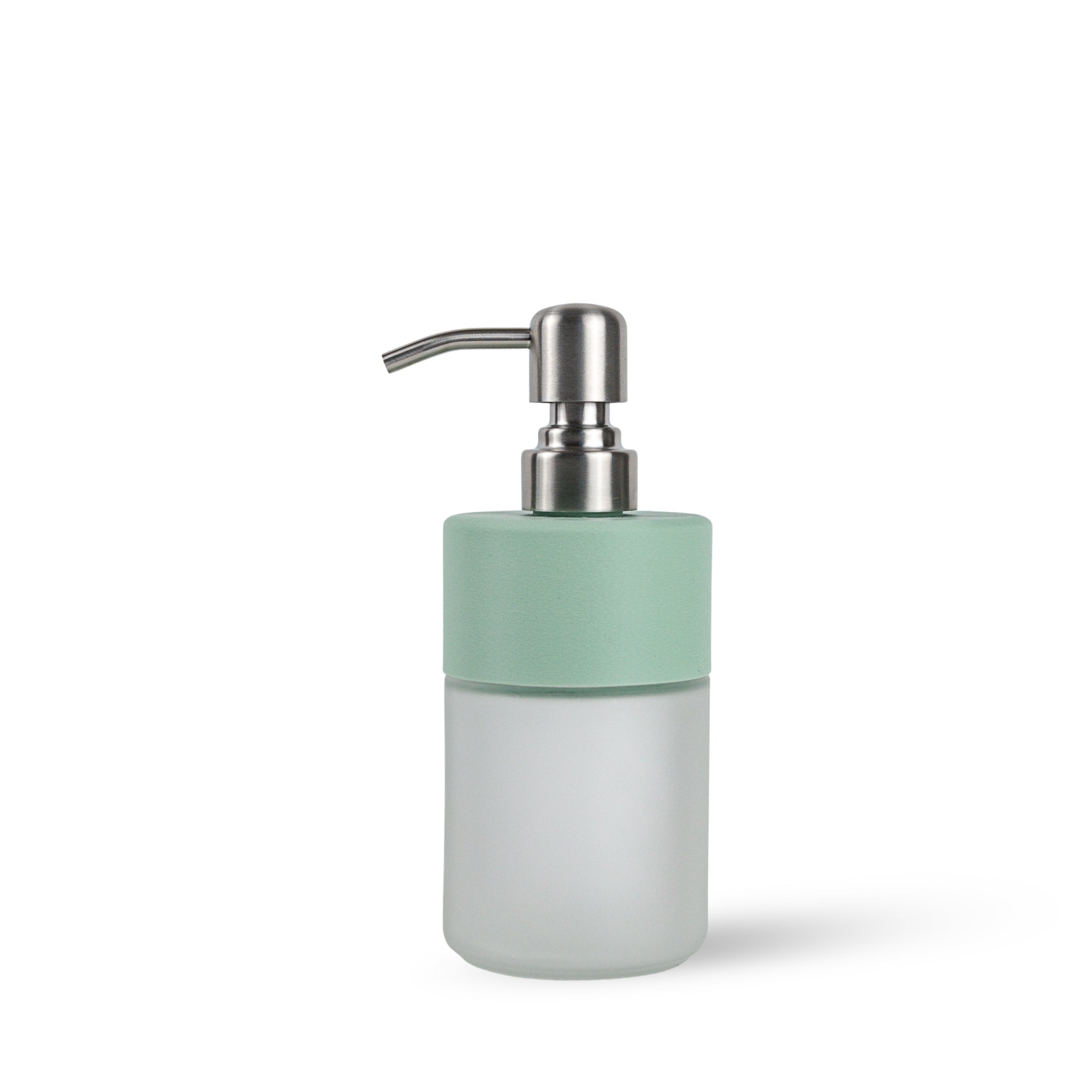 Soap dispenser with a light green top and frosted glass base on a white background