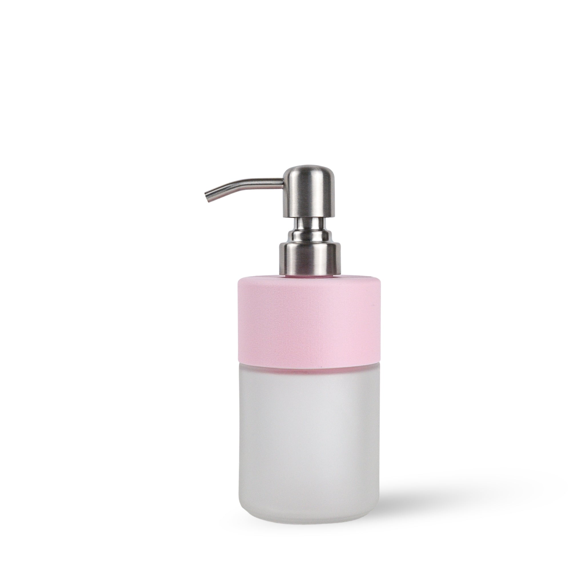 soap dispenser with a soft pink top and frosted glass bottom on a white background