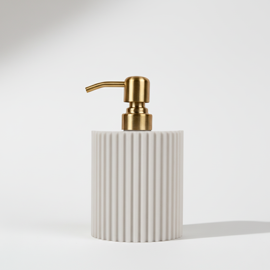 White soap dispenser with gold pump on a white background
