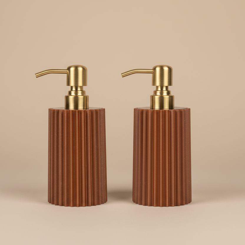 Brown ribbed soap dispenser with gold pump on a white background