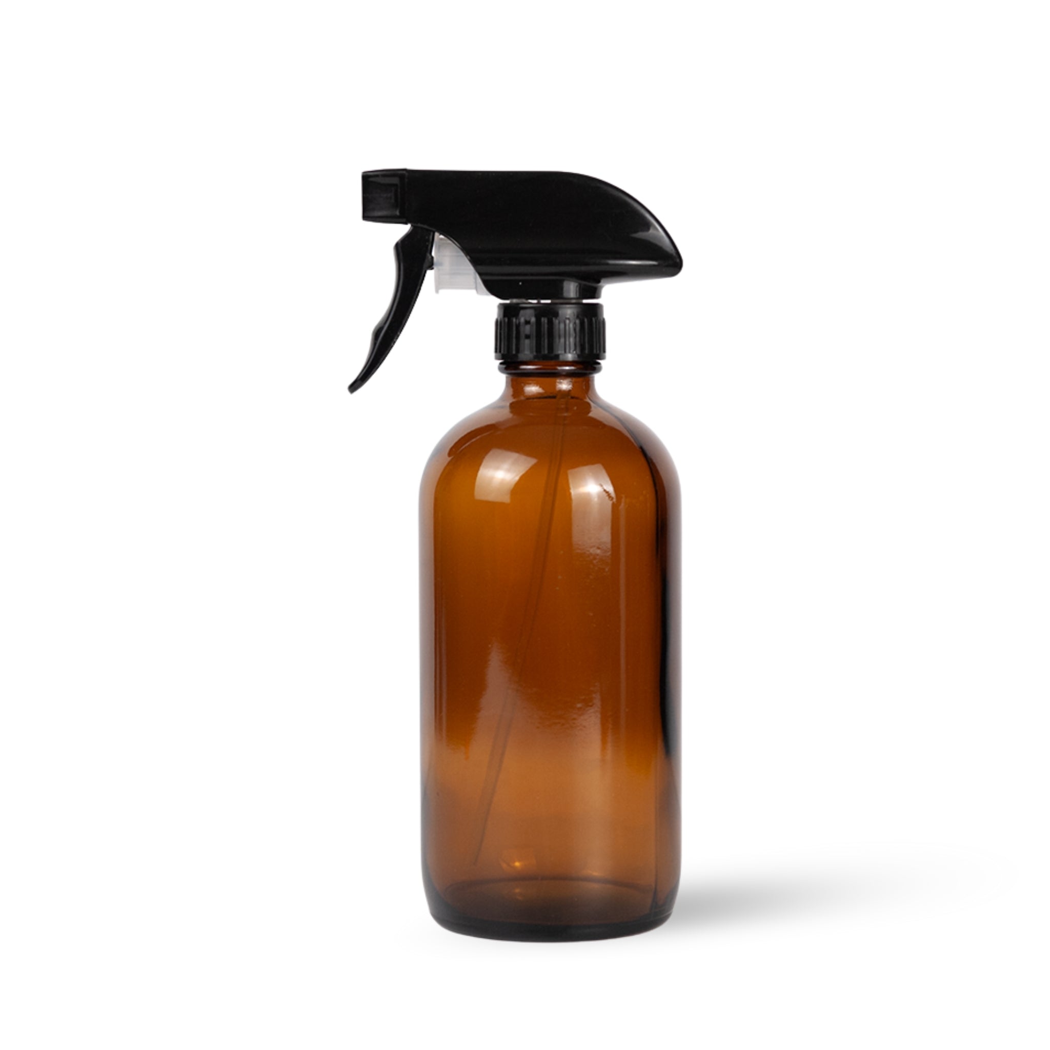 Brown spray bottle with black nozzle on white background