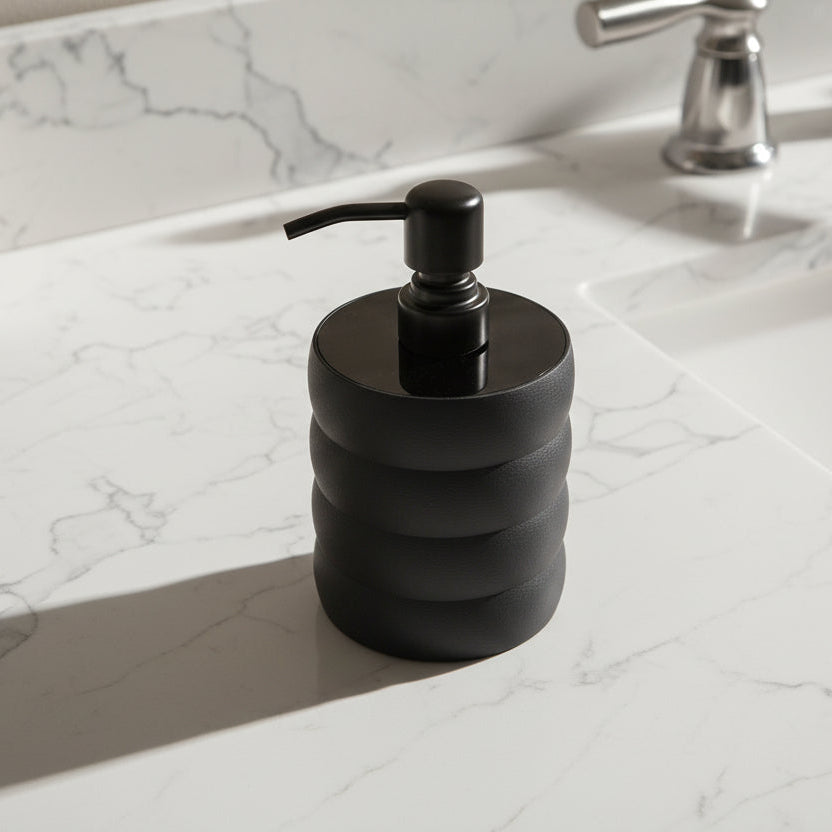 Black ribbed soap dispenser on a white background