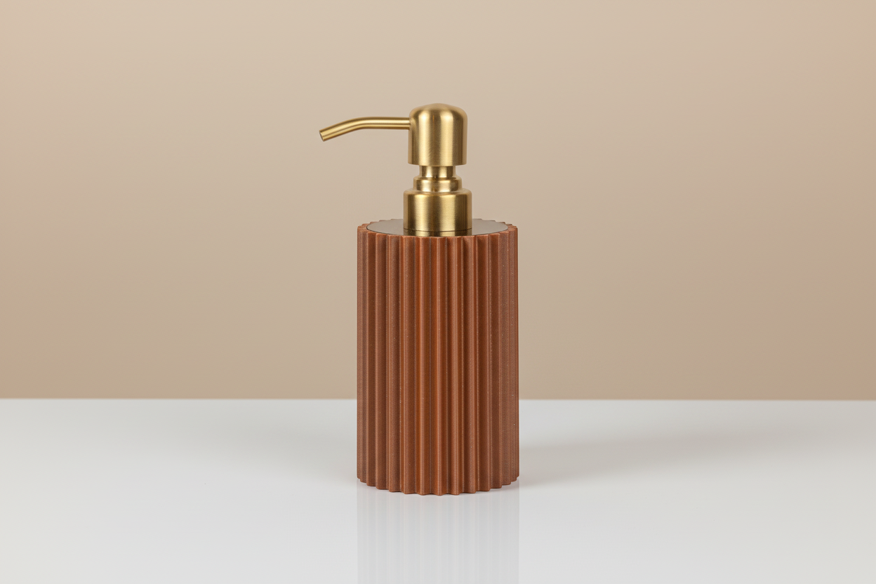bronze & expresso soap dispenser with gold pump on a beige background