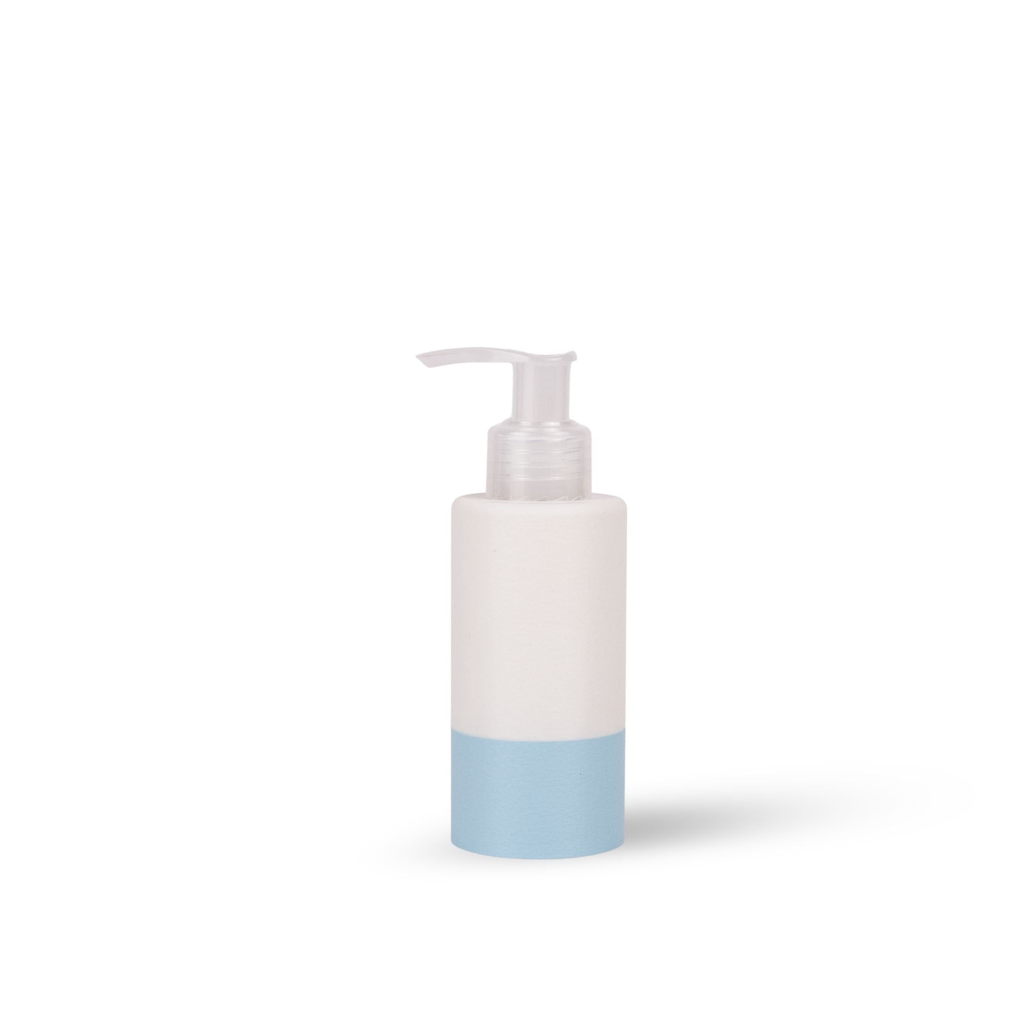 A minimalist pump bottle with a white upper body and a light blue lower band, featuring a clear plastic pump dispenser, set against a plain white background with a soft shadow.