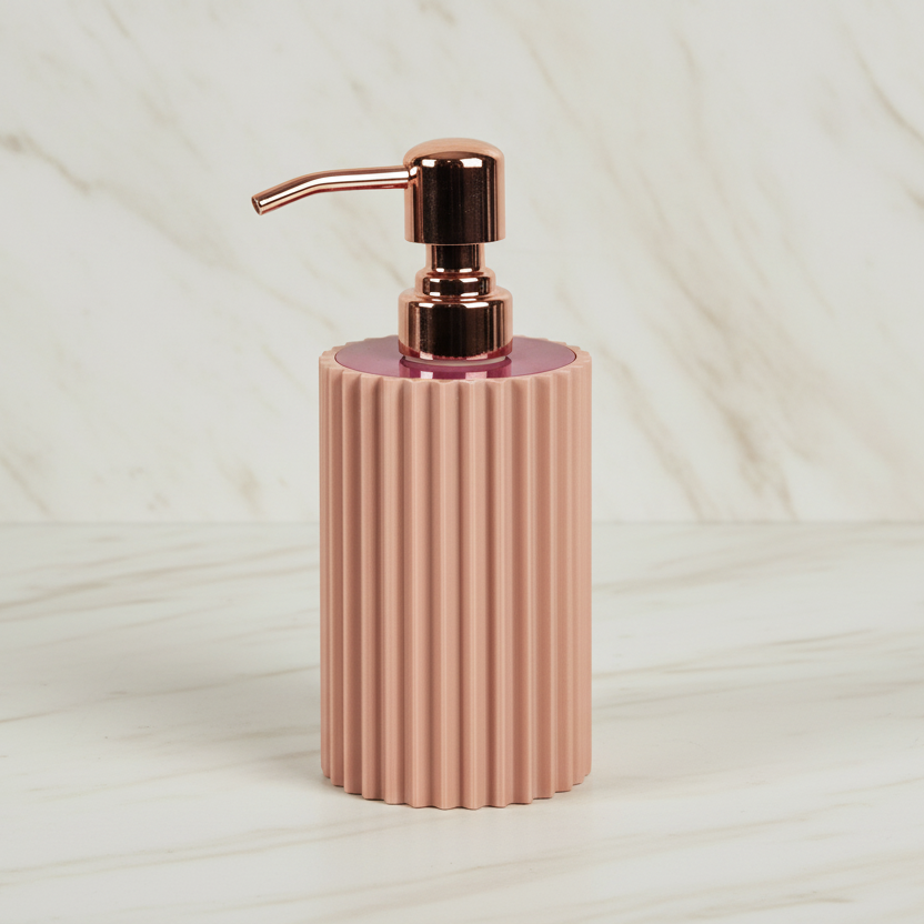 Pink rose ribbed soap dispenser with rose gold pump on a light ivory background
