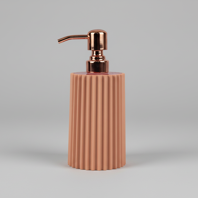 Pink soap dispenser with rose gold pump on a gray background